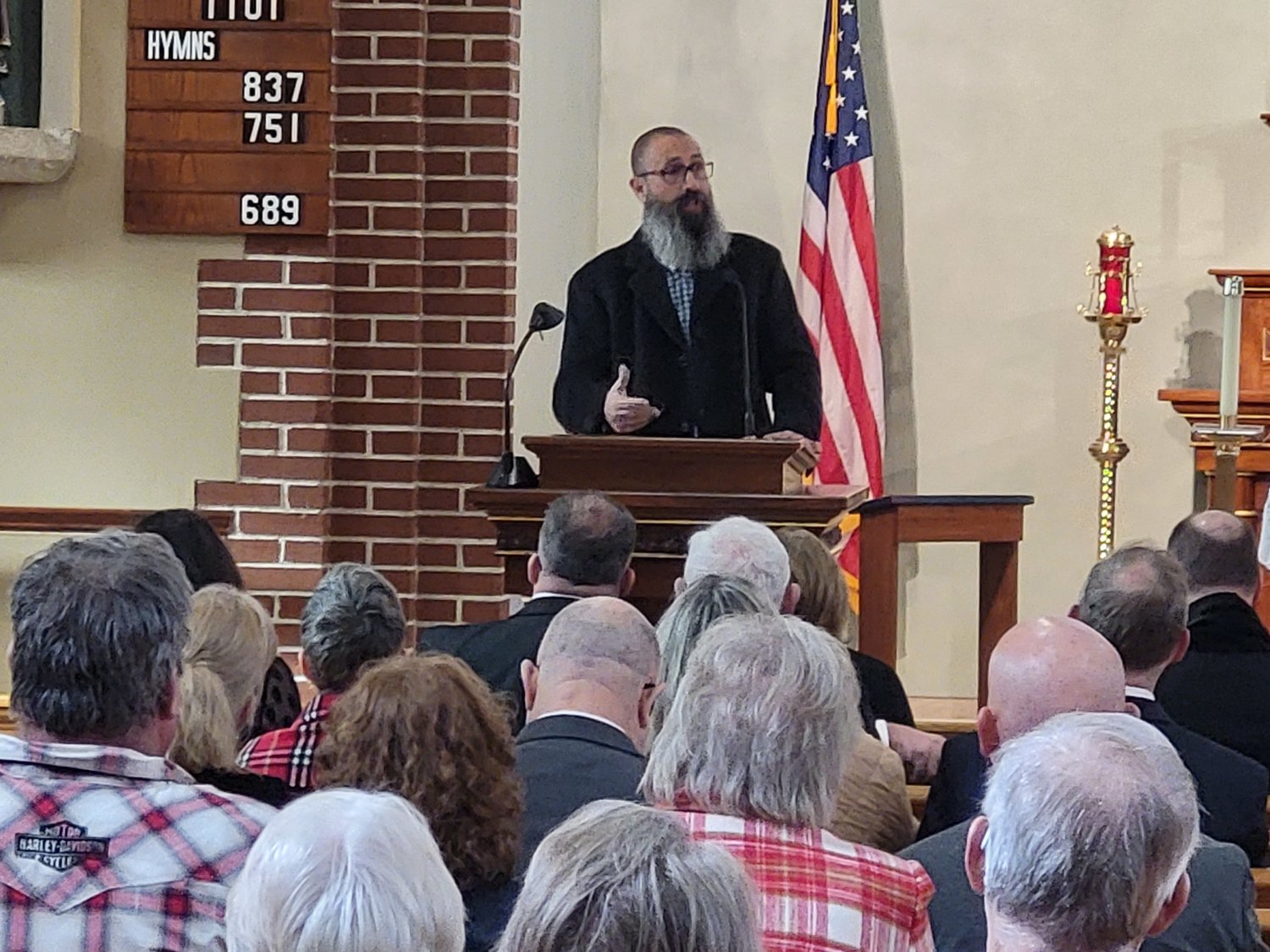 Rami Salfiti, a lifetime resident of the Old City portion of Jerusalem, speaks to members of the Equestrian Order of the Holy Sepulchre of Jerusalem about the situation facing Christians in the Holy Land, on Feb. 5 in St. Stanislaus Church in Wardsville.